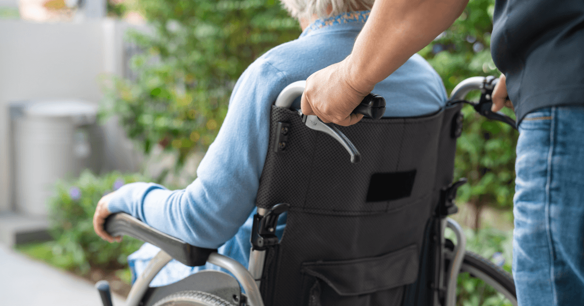 When AHS Home Care Is Not Enough for a Senior at Home in Calgary Senior in a wheelchair receiving supportive care while family considers whether AHS home care is enough in Calgary
